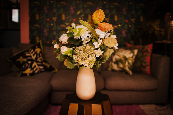 Poppy - An ivory display of blooms, autumnal foliage, poppies, Dahlia, Ranunculus, roses, hellebore and hydrangea. 