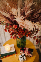 Chic artificial pampas grasses, eucalyptus and cotinus in a stylish green glass vase. Perfect for businesses, large spaces in a home or as a gift.