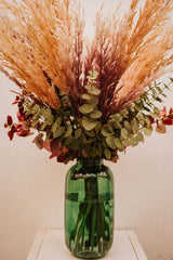 Chic artificial pampas grasses, eucalyptus and cotinus in a stylish green glass vase. Perfect for businesses, large spaces in a home or as a gift.