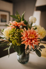 Luxury artificial dahlia, hydrangea and viburnum expertly arranged by our team of florists with seeded eucalyptus and lush lambs ear foliage into a choice of ribbed grey-blue glass vase or green bamboo glass vases or available as a beautifully wrapped bouquet.