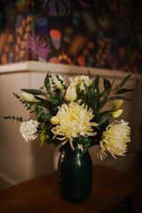 Luxury artificial white tulips, hydrangea, agapanthus and chrysanthemums mingled with the highest quality viburnum and eucalyptus. Expertly arranged by our team of florists into a choice of vases or available as a beautifully wrapped bouquet.