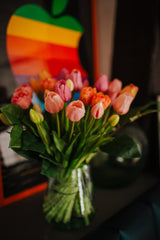 Luxury artificial tulips and salal foliage expertly arranged by our team of florists into a choice of dusky pink metal vase or light green glass vase or available as a beautifully wrapped bouquet.