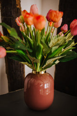 Luxury artificial tulips and salal foliage expertly arranged by our team of florists into a choice of dusky pink metal vase or light green glass vase or available as a beautifully wrapped bouquet.