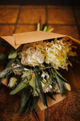 Luxury artificial white tulips, hydrangea, agapanthus and chrysanthemums mingled with the highest quality viburnum and eucalyptus. Expertly arranged by our team of florists into a choice of vases or available as a beautifully wrapped bouquet.