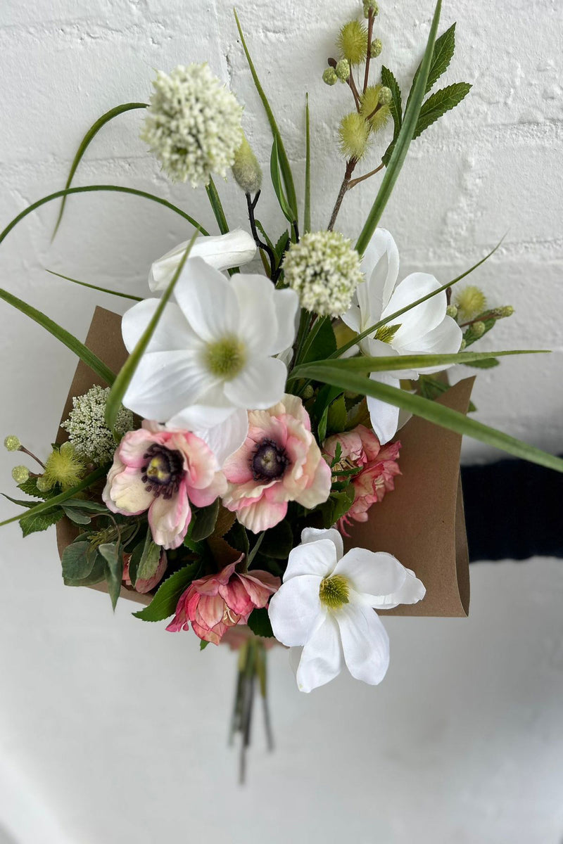 Sugary sweet, our Nuthatch bouquet combines a luxurious collection of subtle pink anemone and hellebore with creamy magnolia and allium topped off with crisp green mimosa.   These beautiful blooms have been hand-tied and gift wrapped by our team of expert florists ready to unbox and enjoy for years to come.