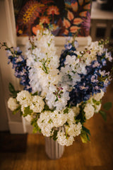 Luxury artificial delphinium, viburnum Snowball and salal foliage expertly arranged by our team of florists into a ceramic vases or available as a beautifully wrapped bouquet. Perfect for corporate and larger spaces.