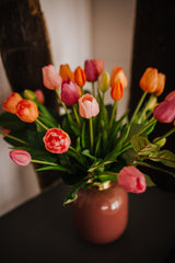 Luxury artificial tulips and salal foliage expertly arranged by our team of florists into a choice of dusky pink metal vase or light green glass vase or available as a beautifully wrapped bouquet.