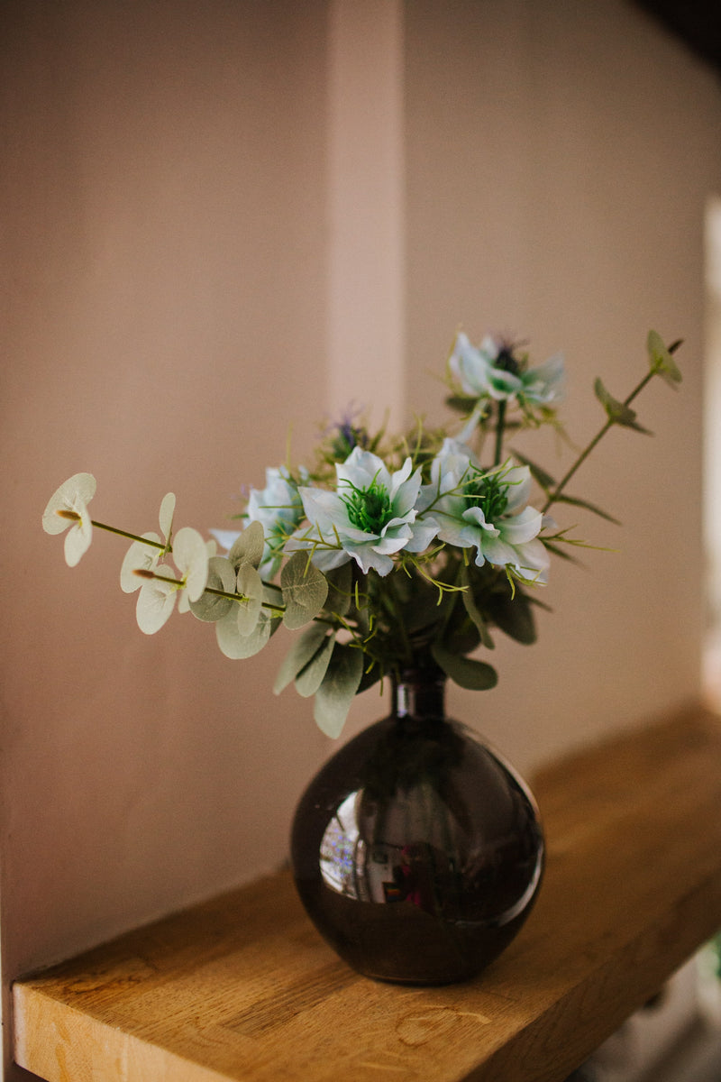 Our Ella bottle vase of sky blue nigella is utterly charming and guaranteed to add a touch of magic to any space.