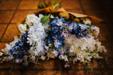 Luxury artificial delphinium, viburnum Snowball and salal foliage expertly arranged by our team of florists into a ceramic vases or available as a beautifully wrapped bouquet. Perfect for corporate and larger spaces.