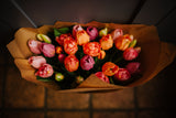 Luxury artificial tulips and salal foliage expertly arranged by our team of florists into a choice of dusky pink metal vase or light green glass vase or available as a beautifully wrapped bouquet.