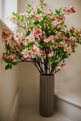 Realistic artificial Blossom flower arrangement in a chic off white vase perfect for the home or to gift.