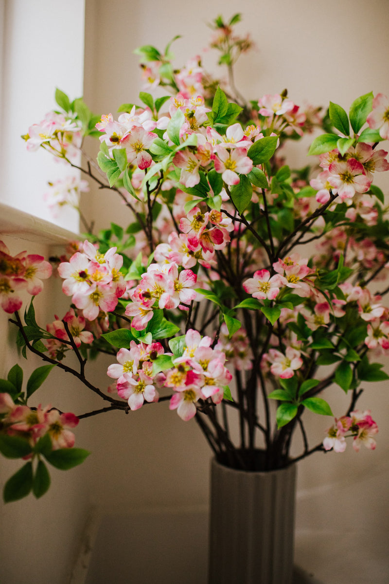 Realistic artificial Blossom flower arrangement in a chic off white vase perfect for the home or to gift.
